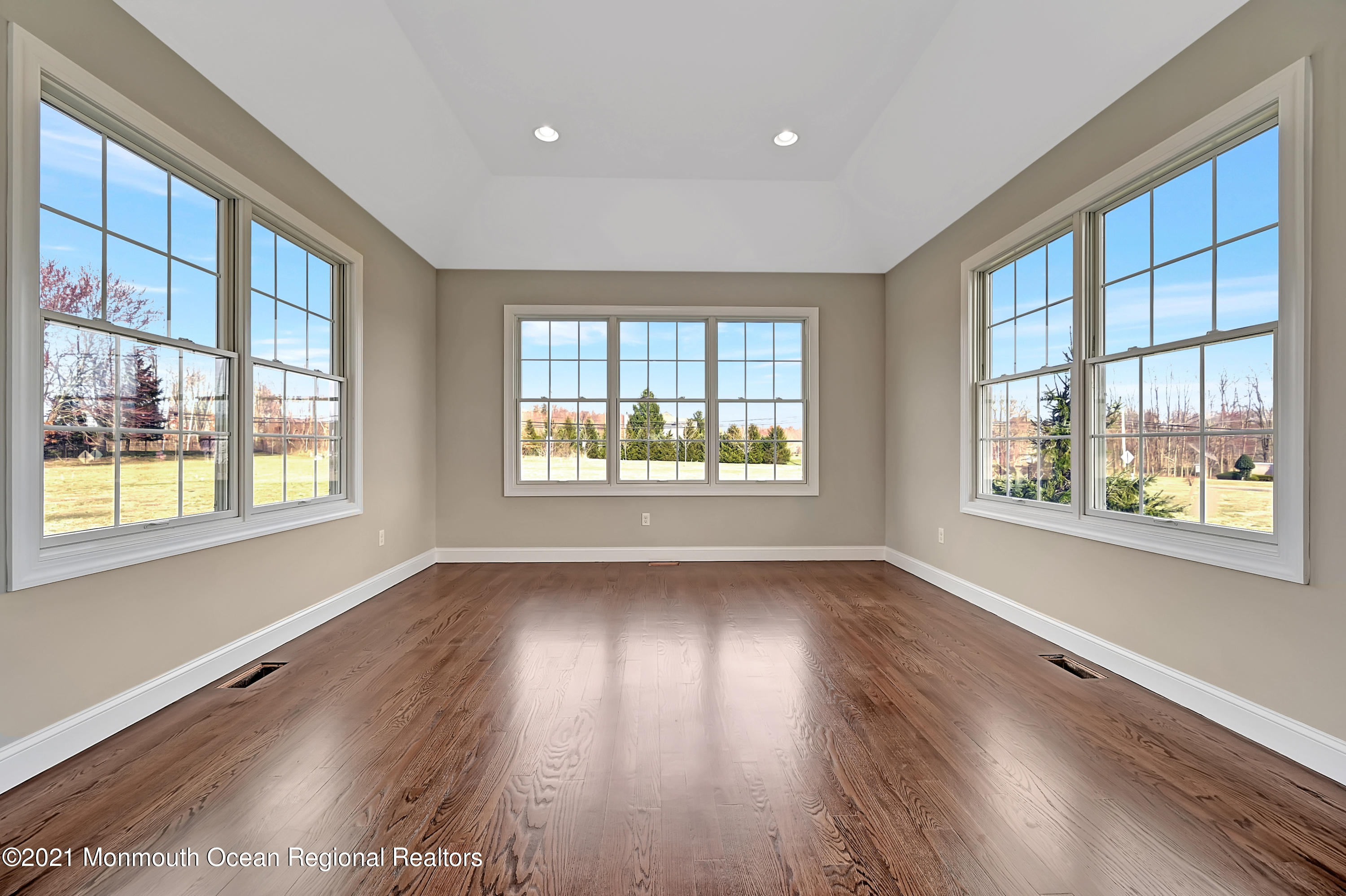 3 Cook Court Millstone Township, NJ 08535 - Photo 8 of 40 a view of an empty room with wooden floor and a window