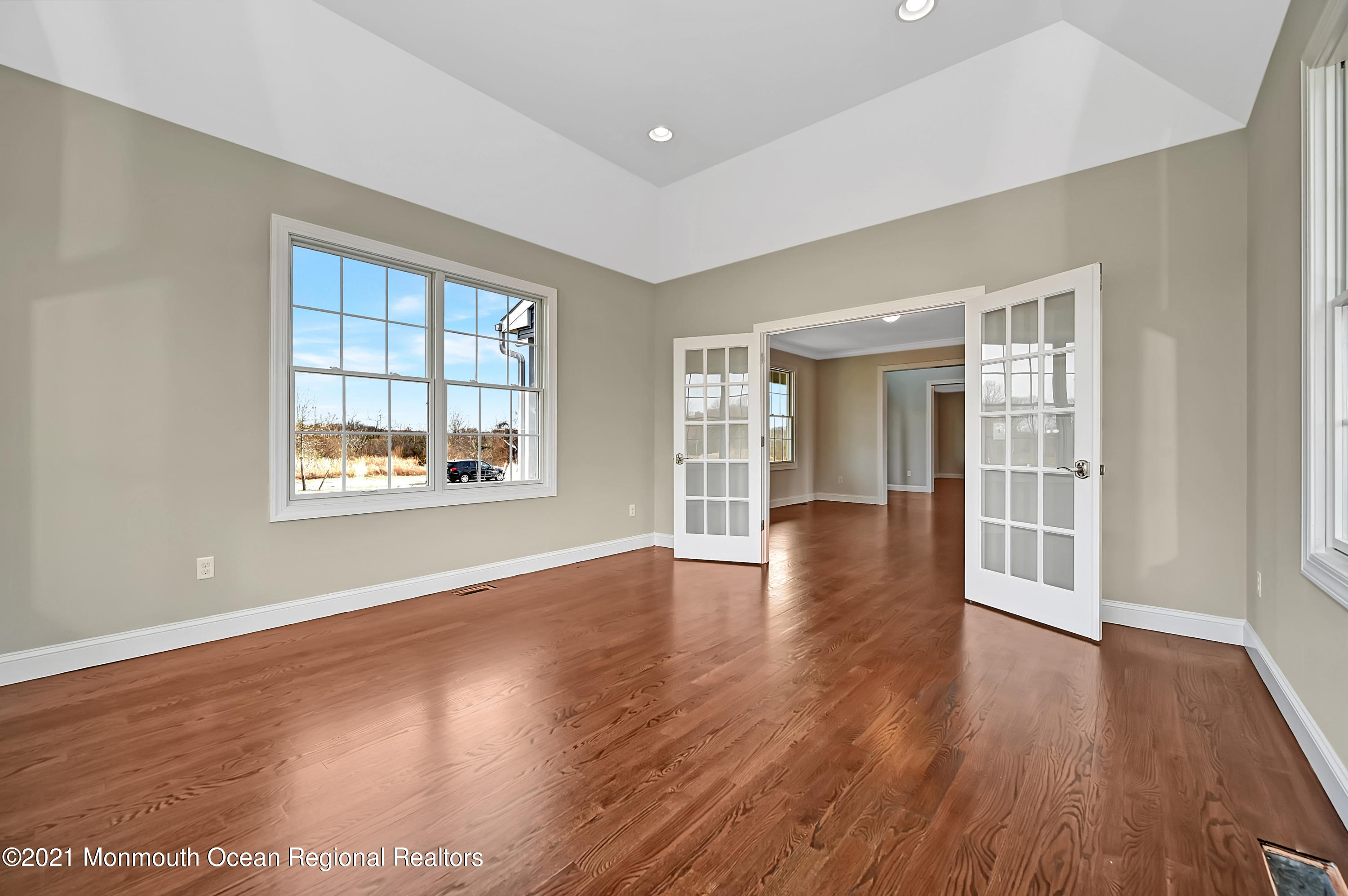 3 Cook Court Millstone Township, NJ 08535 - Photo 9 of 40 an empty room with wooden floor and windows
