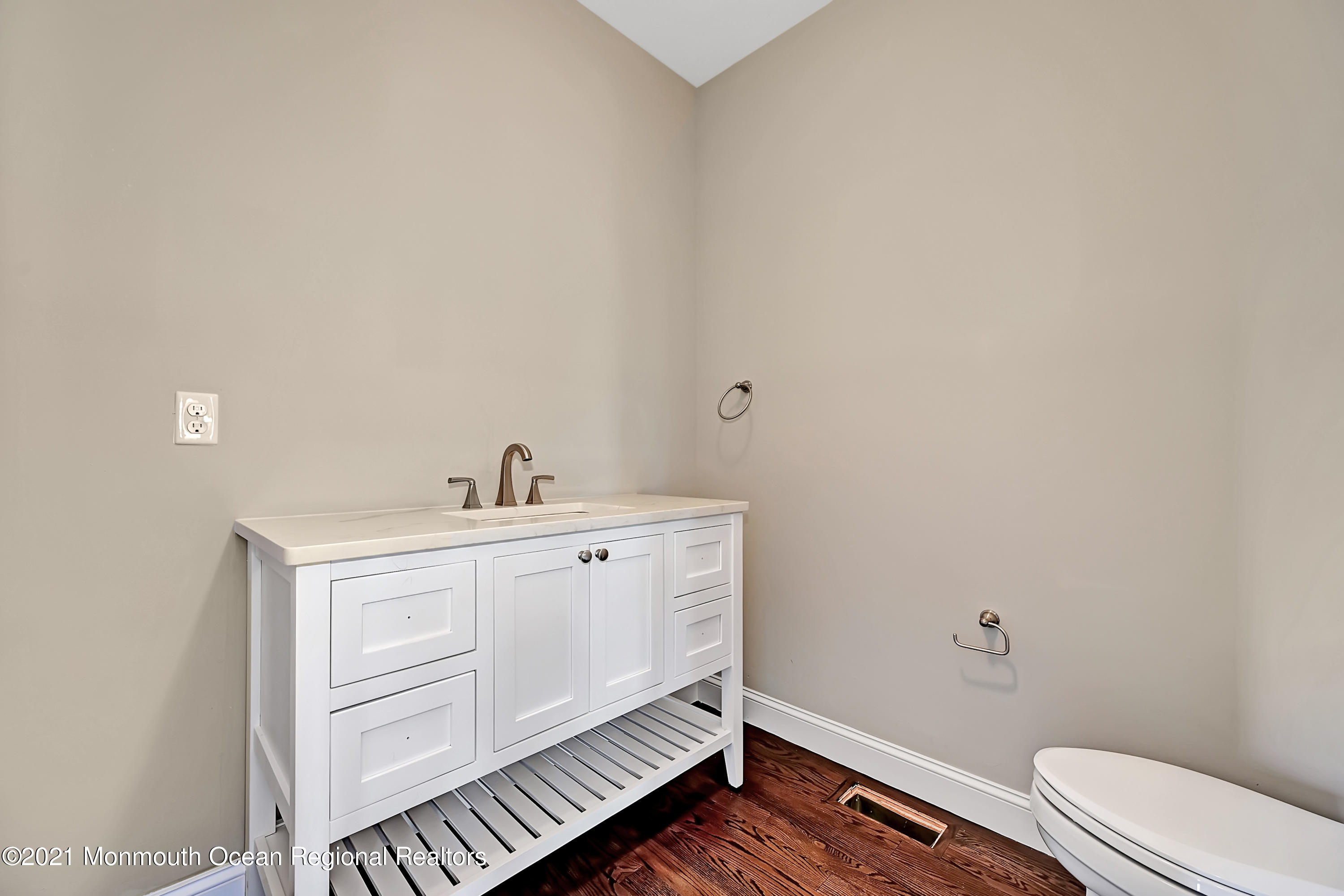 3 Cook Court Millstone Township, NJ 08535 - Photo 10 of 40 a spacious bathroom with a sink toilet and a mirror