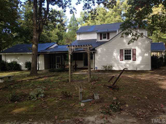 1569 Longs Store Road Roxboro, NC 27574 - Photo 2 of 22 a view of a house with a yard and a tree