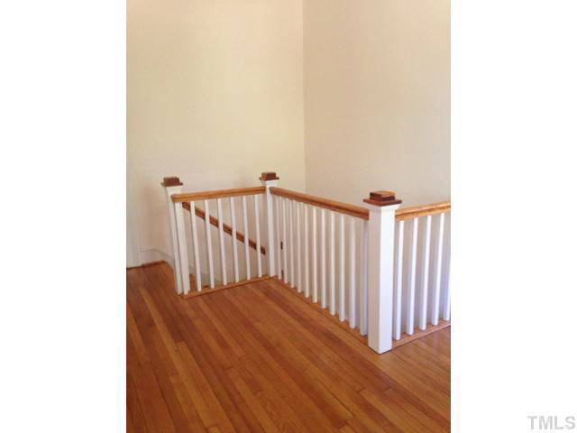 1569 Longs Store Road Roxboro, NC 27574 - Photo 11 of 22 a view of a hallway with wooden floor