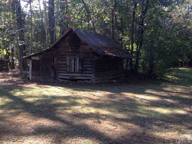 1569 Longs Store Road Roxboro, NC 27574 - Photo 18 of 22 a view of a house with a yard