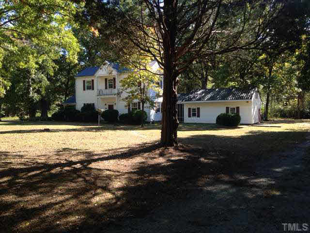 1569 Longs Store Road Roxboro, NC 27574 - Photo 20 of 22 a view of a house with a yard