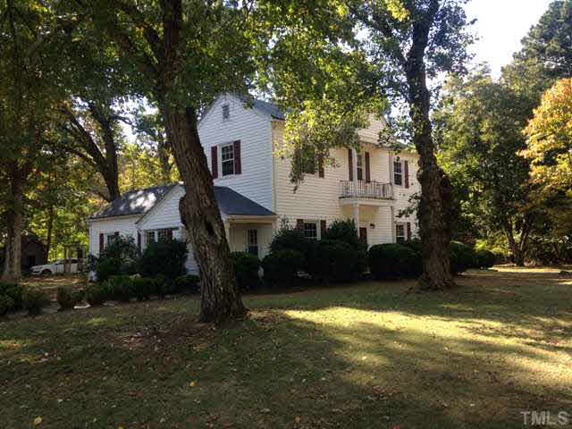 1569 Longs Store Road Roxboro, NC 27574 - Photo 4 of 22 a house view with a garden space