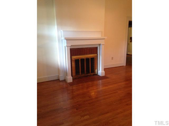 1569 Longs Store Road Roxboro, NC 27574 - Photo 7 of 22 a view of empty room with a fireplace