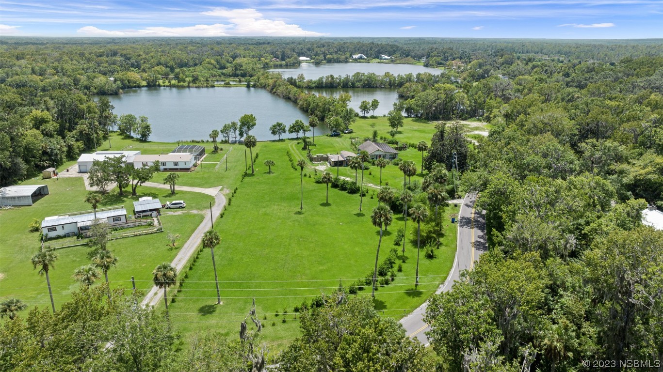 2422 South Taylor Road New Smyrna Beach, FL 32168 - Photo 12 of 19 a view of a lake with a mountain in the back