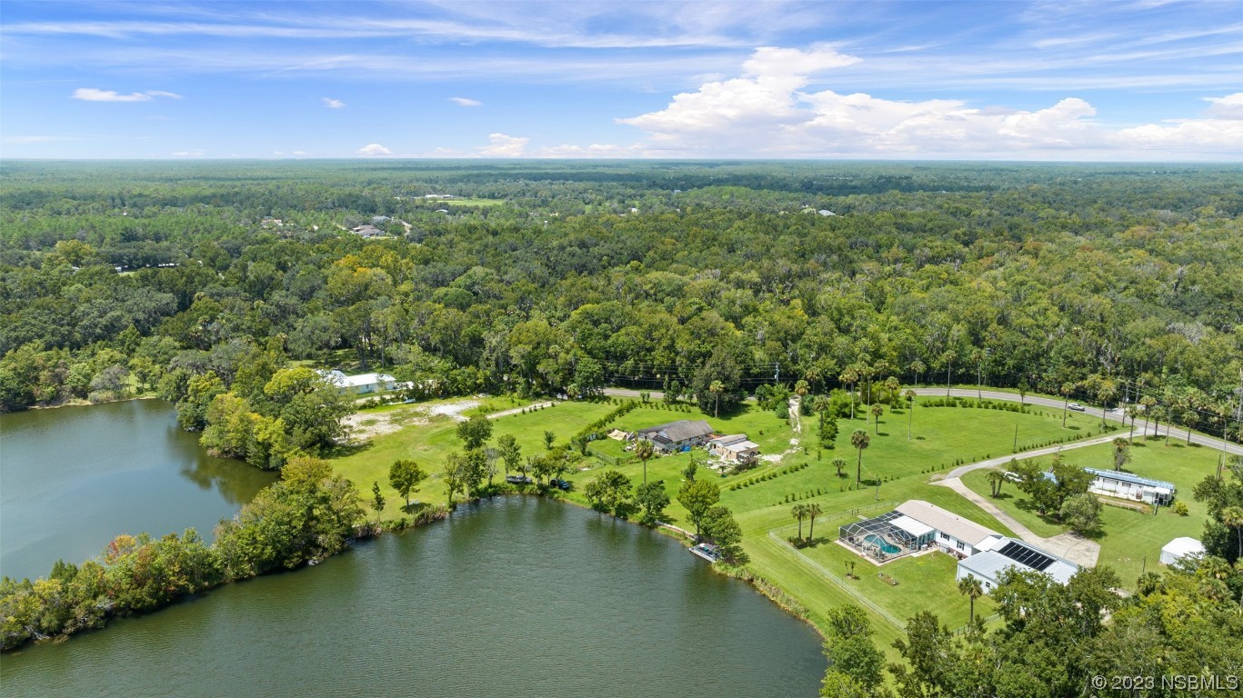 2422 South Taylor Road New Smyrna Beach, FL 32168 - Photo 13 of 19 a view of a lake with a city