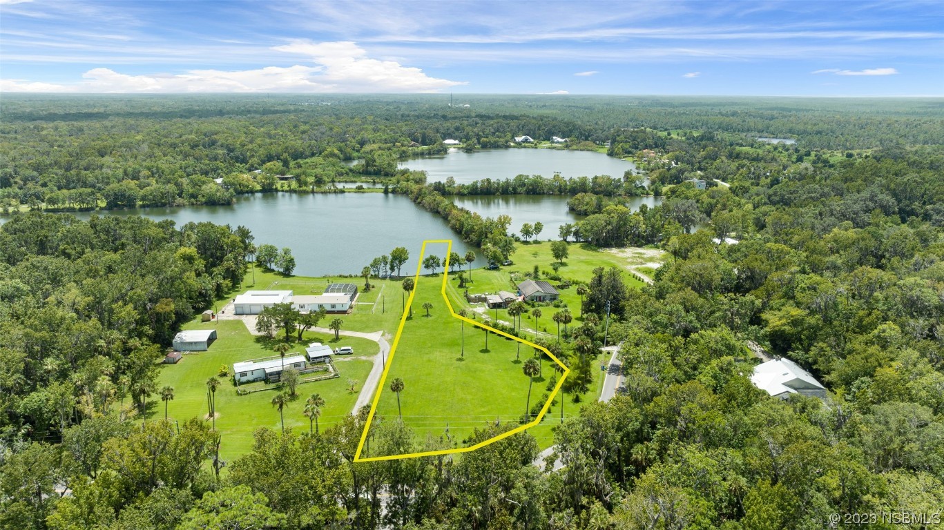 2422 South Taylor Road New Smyrna Beach, FL 32168 - Photo 2 of 19 an aerial view of residential houses with outdoor space and swimming pool