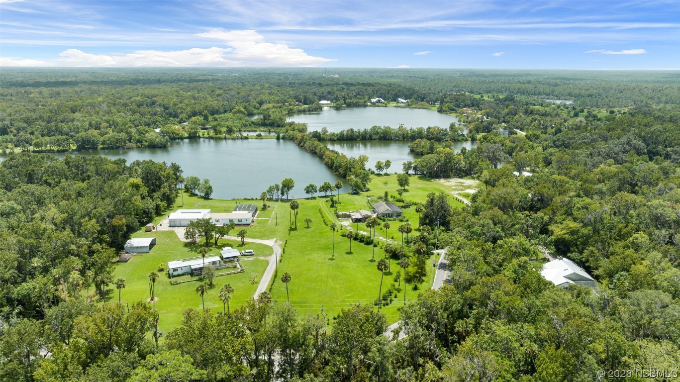 2422 South Taylor Road New Smyrna Beach, FL 32168 - Photo 6 of 19 a view of a lake with a city