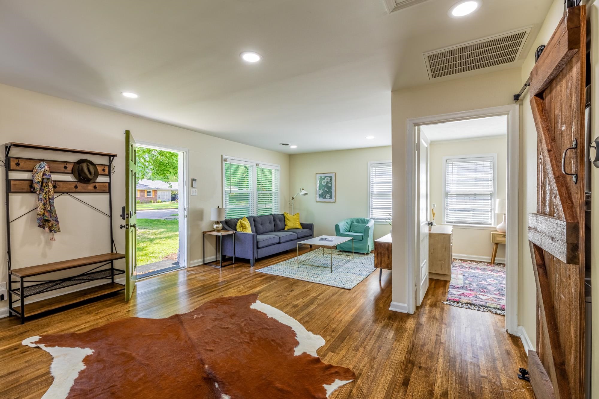 4620 Sea Isle Road Memphis, TN 38117 - Photo 5 of 14 a living room with furniture floor to ceiling window and wooden floor