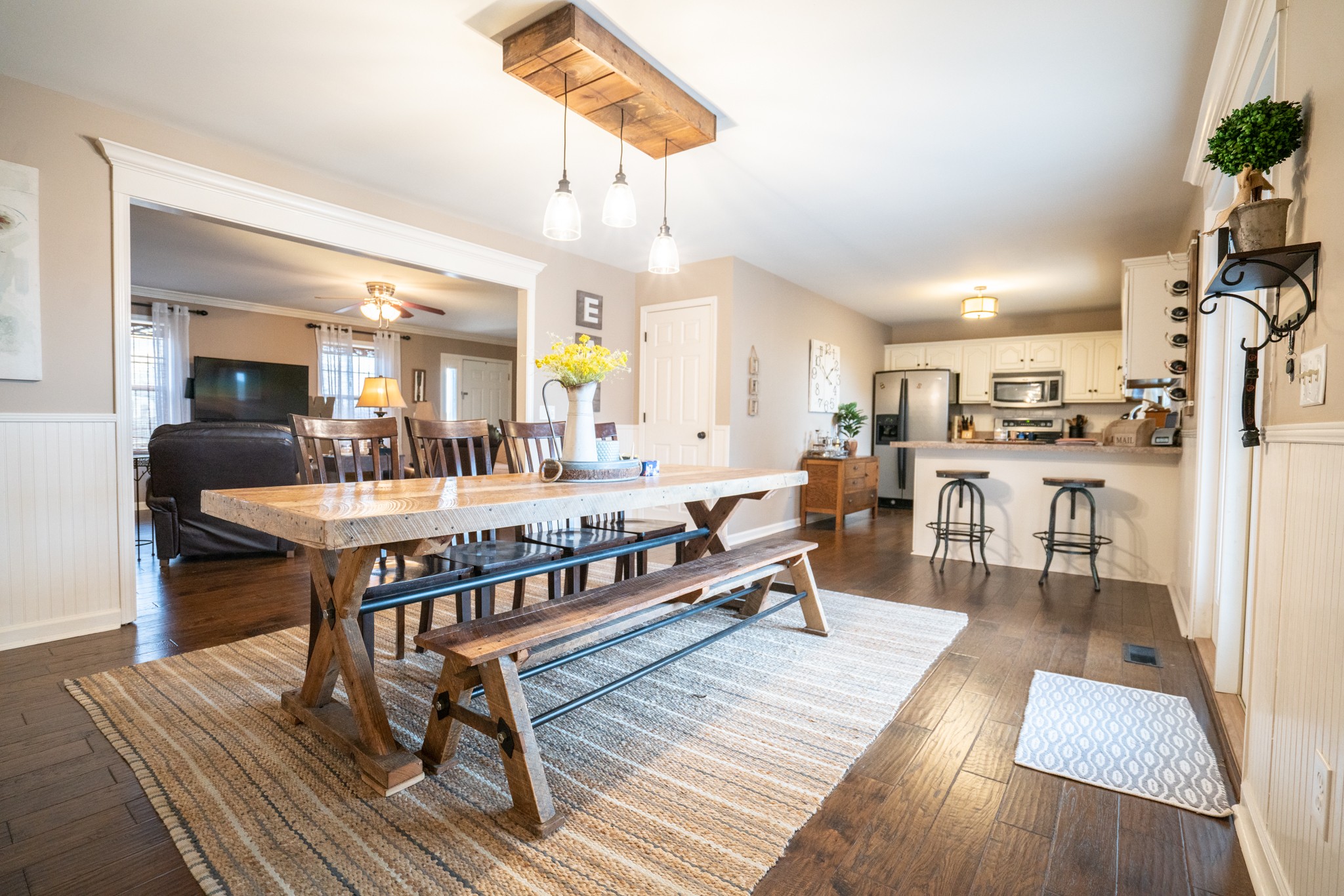 3065 Greens Mill Road Spring Hill, TN 37174 - Photo 8 of 50 a living room with stainless steel appliances kitchen island granite countertop furniture and a wooden floor