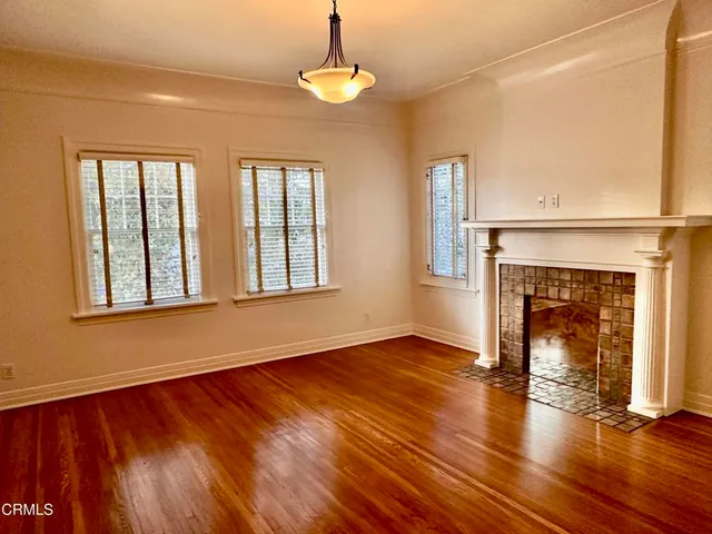 a view of a dining room with furniture and a window