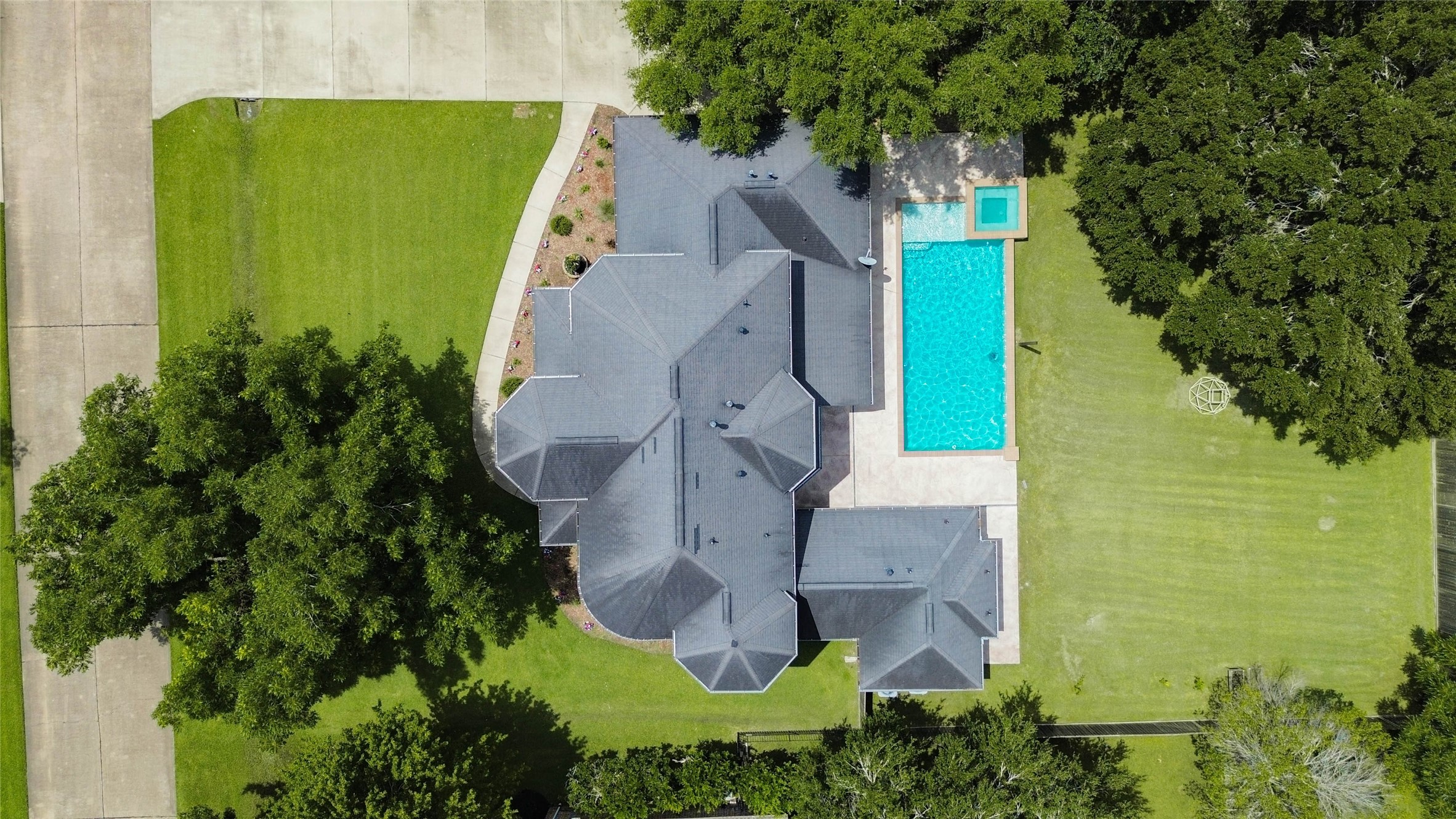 5327 Whitmore Fulshear, TX 77441 - Photo 1 of 50 An overhead view provides a unique perspective of the home's impressive footprint, expansive backyard, and sparkling pool retreat.