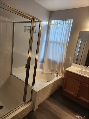 a bathroom with a bathtub and a shower