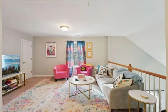 a bedroom with furniture and a flat screen tv