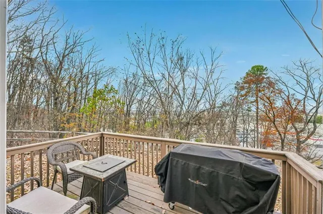 a porch with a bench next to a yard