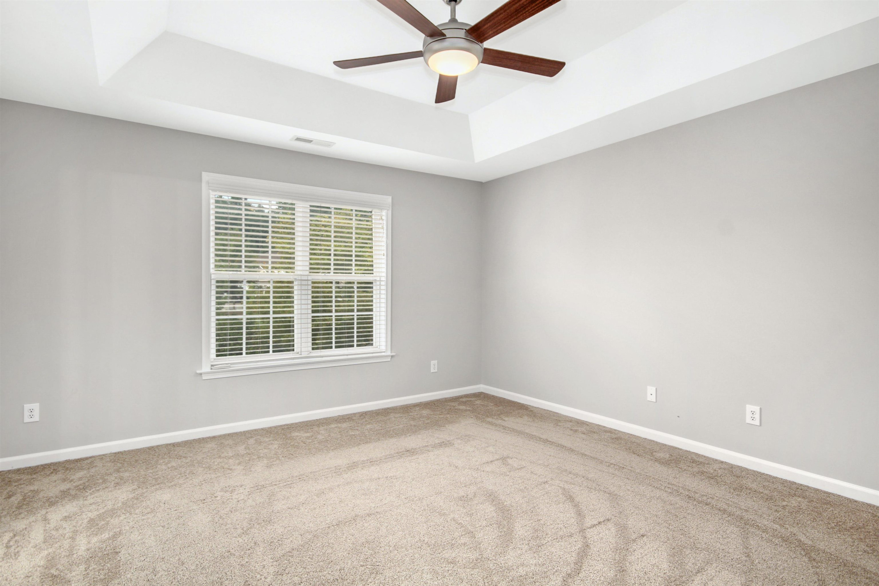 175 Sioux Lane Clayton, NC 27520 - Photo 13 of 26 an empty room with a window and a fan