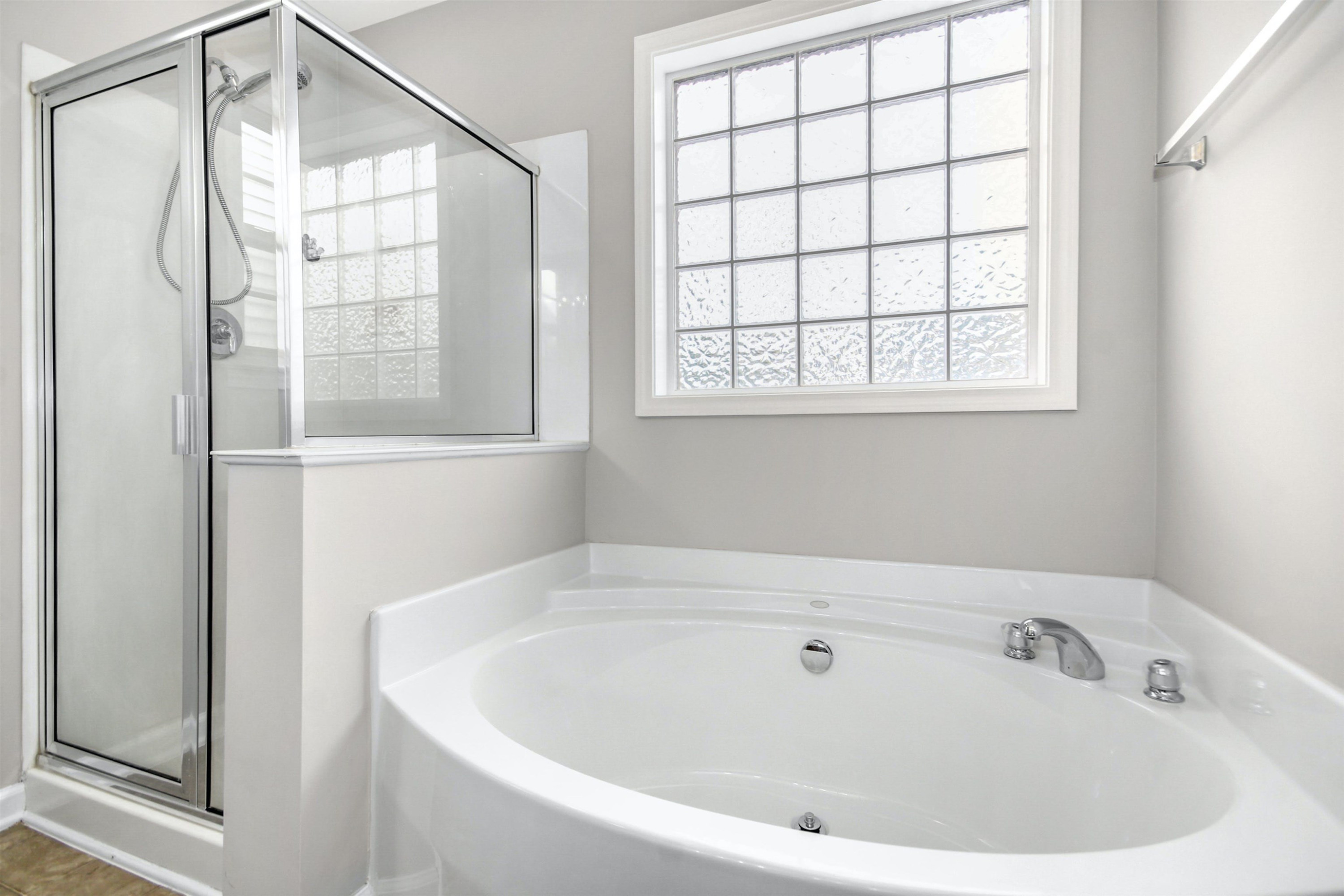 175 Sioux Lane Clayton, NC 27520 - Photo 17 of 26 a white bath tub sitting next to a window