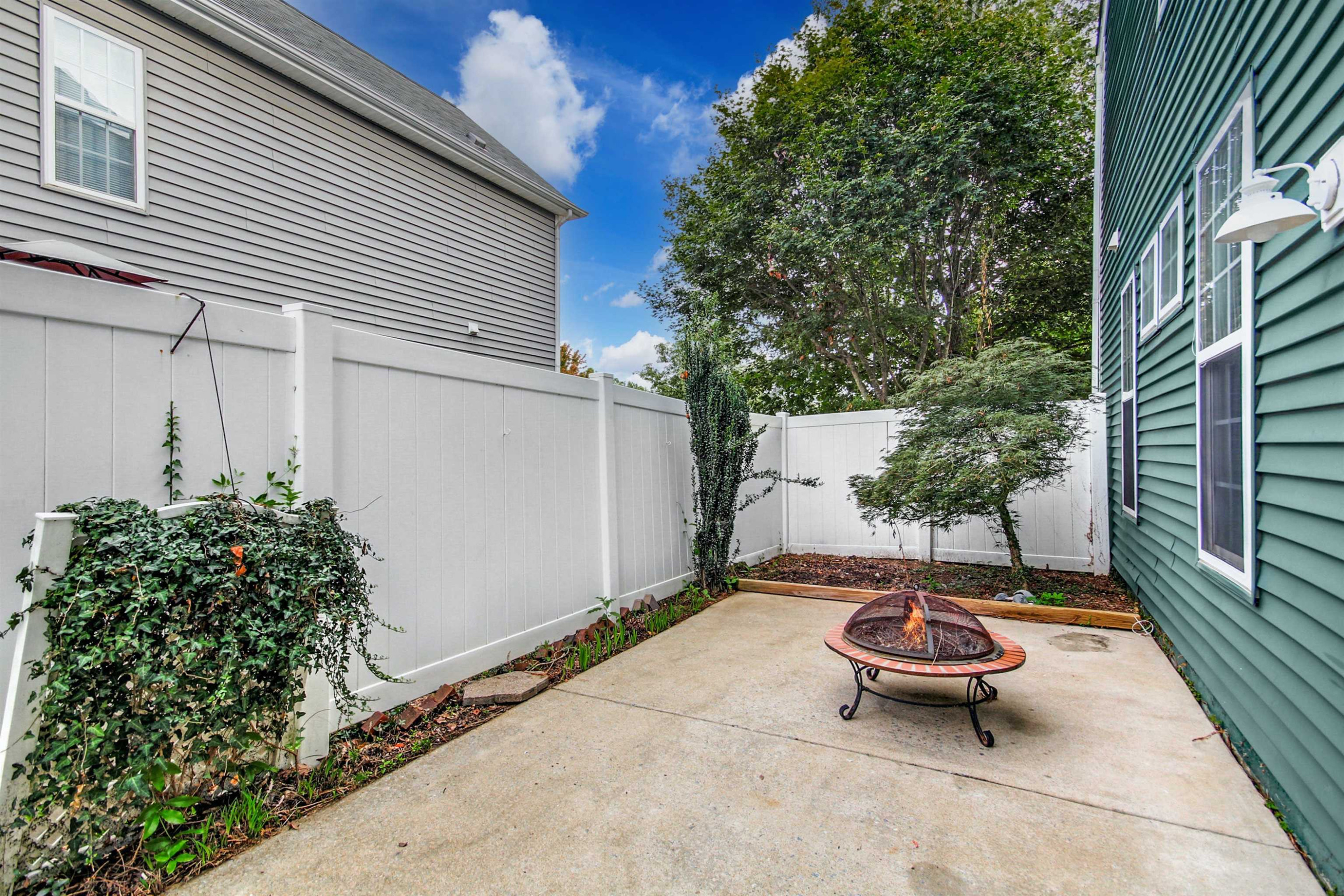 175 Sioux Lane Clayton, NC 27520 - Photo 22 of 26 a backyard of a house with yard and outdoor seating