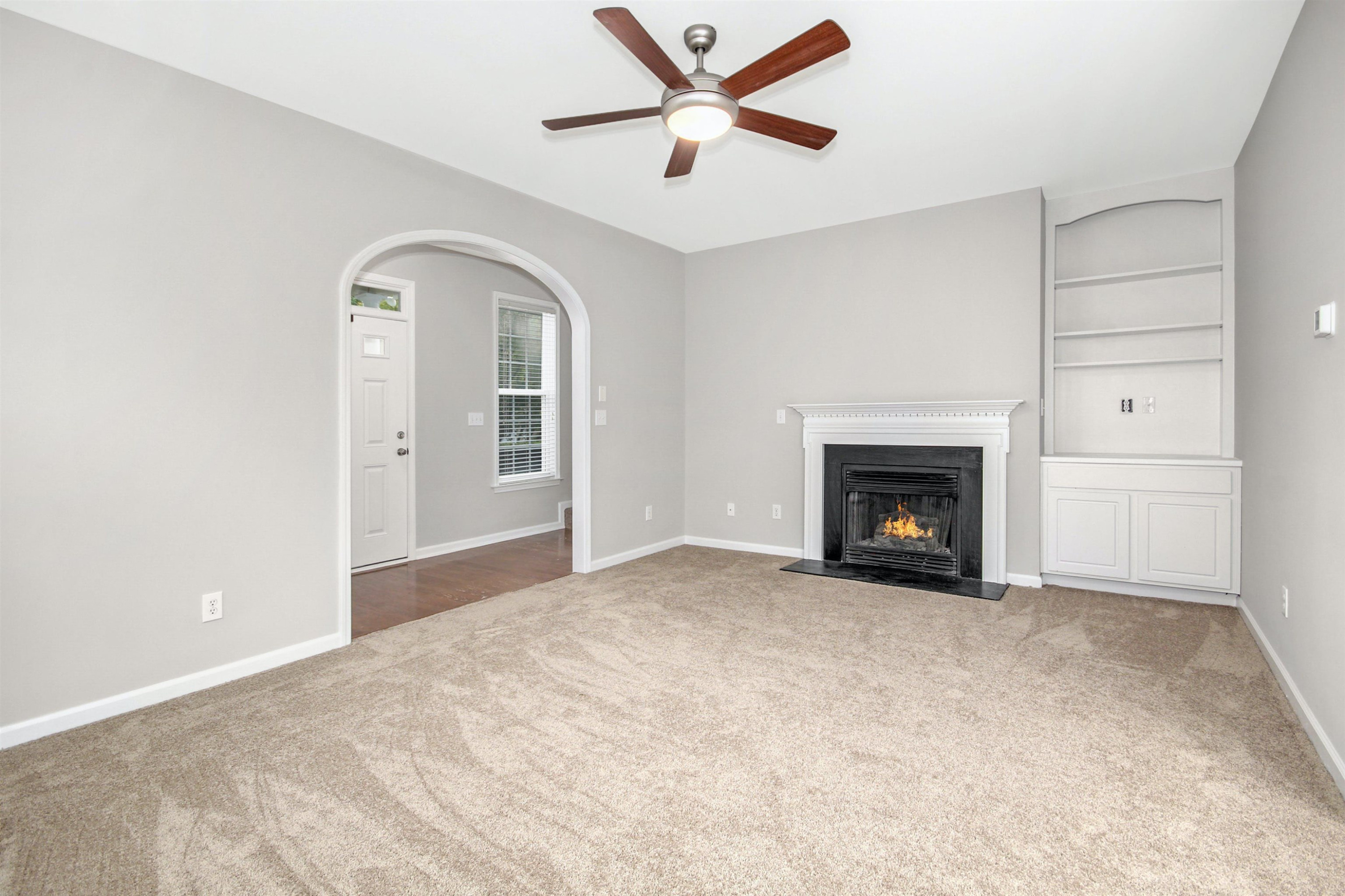 175 Sioux Lane Clayton, NC 27520 - Photo 8 of 26 a view of empty room with a fireplace
