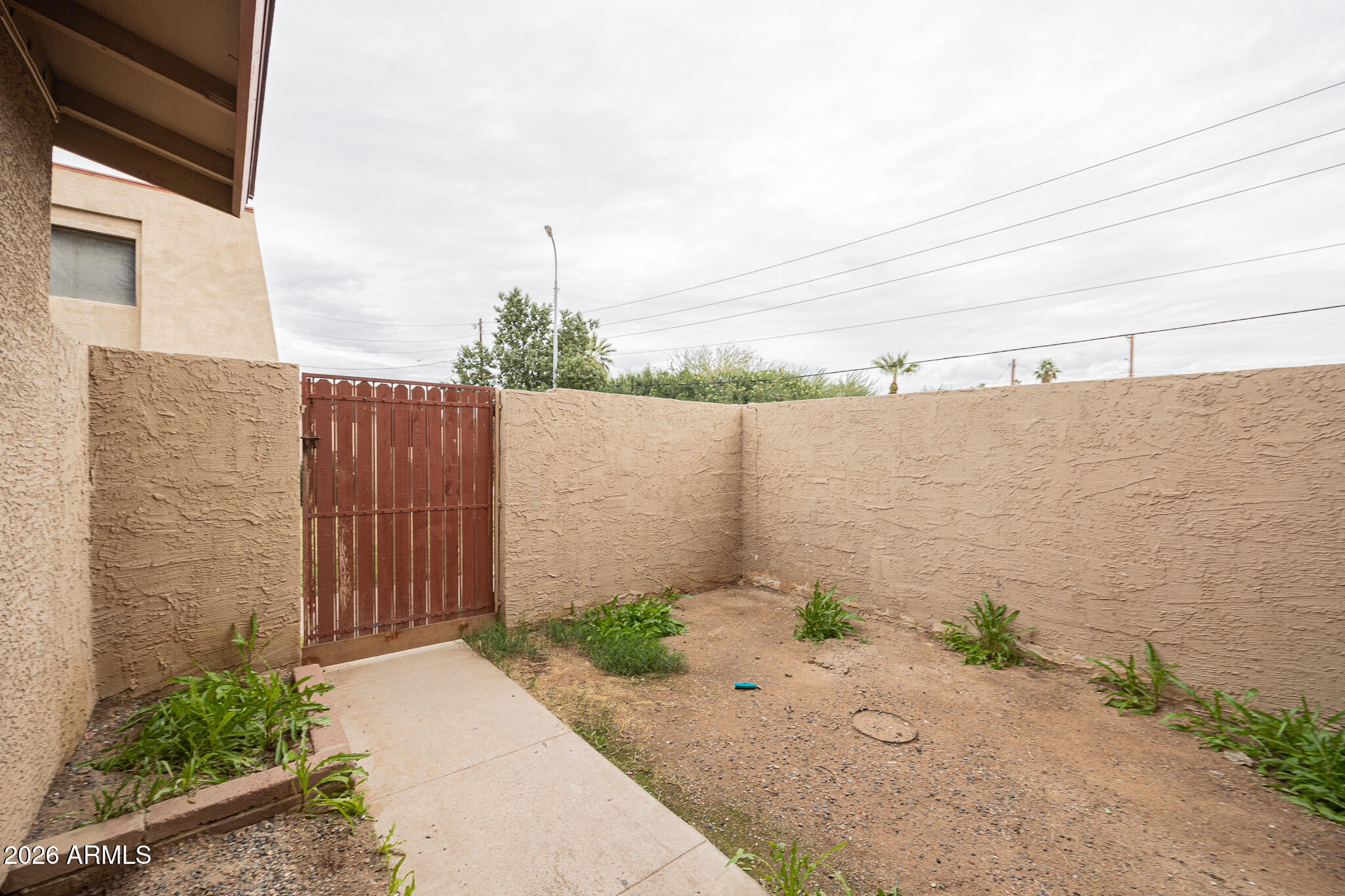 5041 North 39th Lane Phoenix, AZ 85019 - Photo 14 of 15 a backyard of a house
