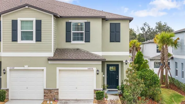 a front view of a house with a garage