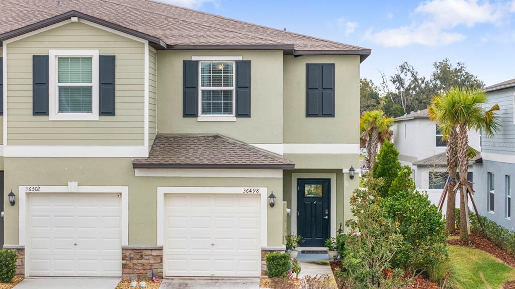 a front view of a house with a garage