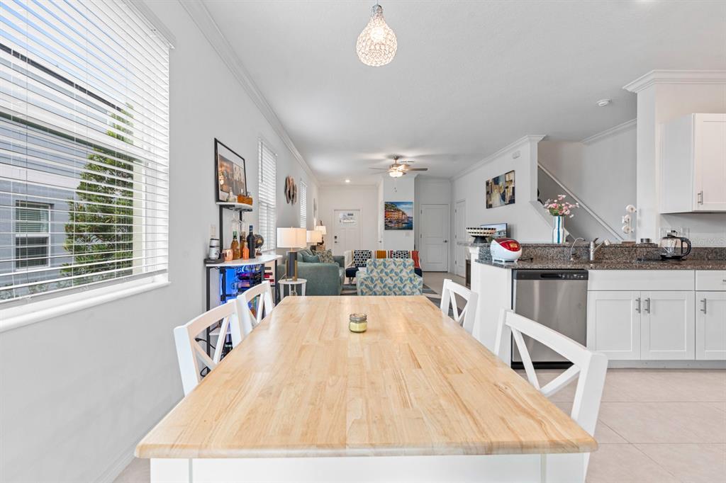 36498 Camp Fire Terrace Zephyrhills, FL 33541 - Photo 14 of 38 a view of kitchen with furniture and window
