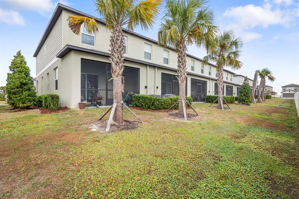 36498 Camp Fire Terrace Zephyrhills, FL 33541 - Photo 30 of 38 a front view of a house with garden