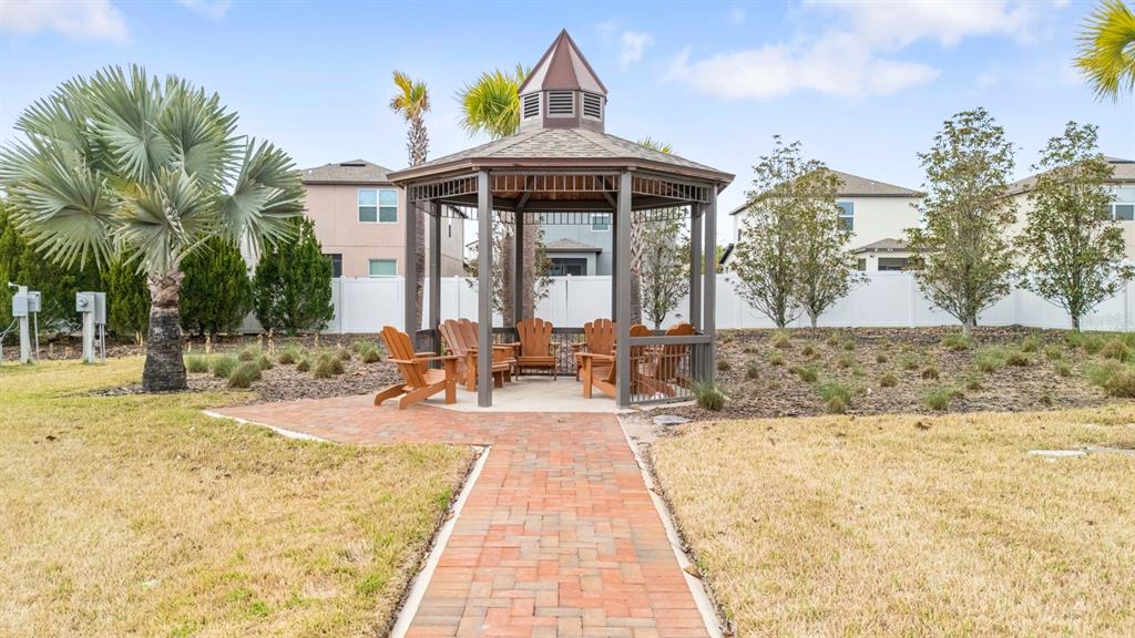 36498 Camp Fire Terrace Zephyrhills, FL 33541 - Photo 37 of 38 a view of a house with snow on the floor