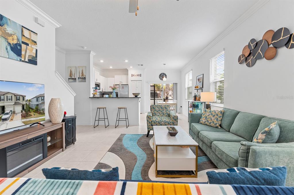 36498 Camp Fire Terrace Zephyrhills, FL 33541 - Photo 7 of 38 a living room with furniture and a couch