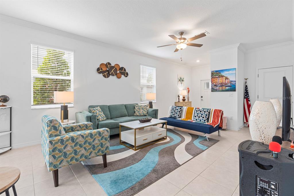 36498 Camp Fire Terrace Zephyrhills, FL 33541 - Photo 8 of 38 a living room with furniture and a window