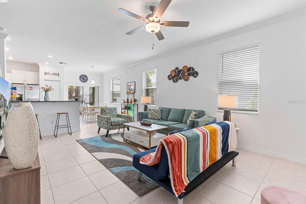 36498 Camp Fire Terrace Zephyrhills, FL 33541 - Photo 9 of 38 a spacious bedroom with a bed and window