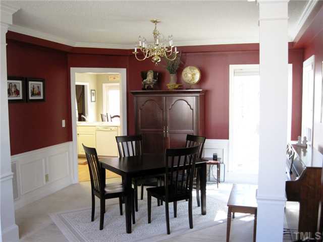 8508 Wheeling Drive Raleigh, NC 27615 - Photo 12 of 12 Lovely dining room with lots of sunshine is open to the sunken living room. This floorplan is great for entertaining.