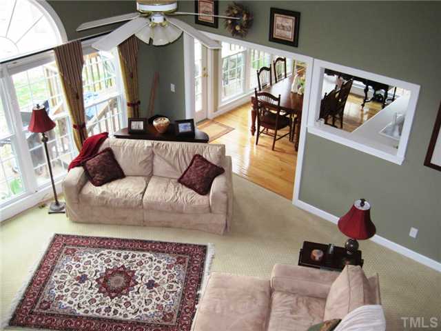 8508 Wheeling Drive Raleigh, NC 27615 - Photo 6 of 12 View of the family room and kitchen from the second floor. Two story family room with a wall of windows is bright and great for family and friends.