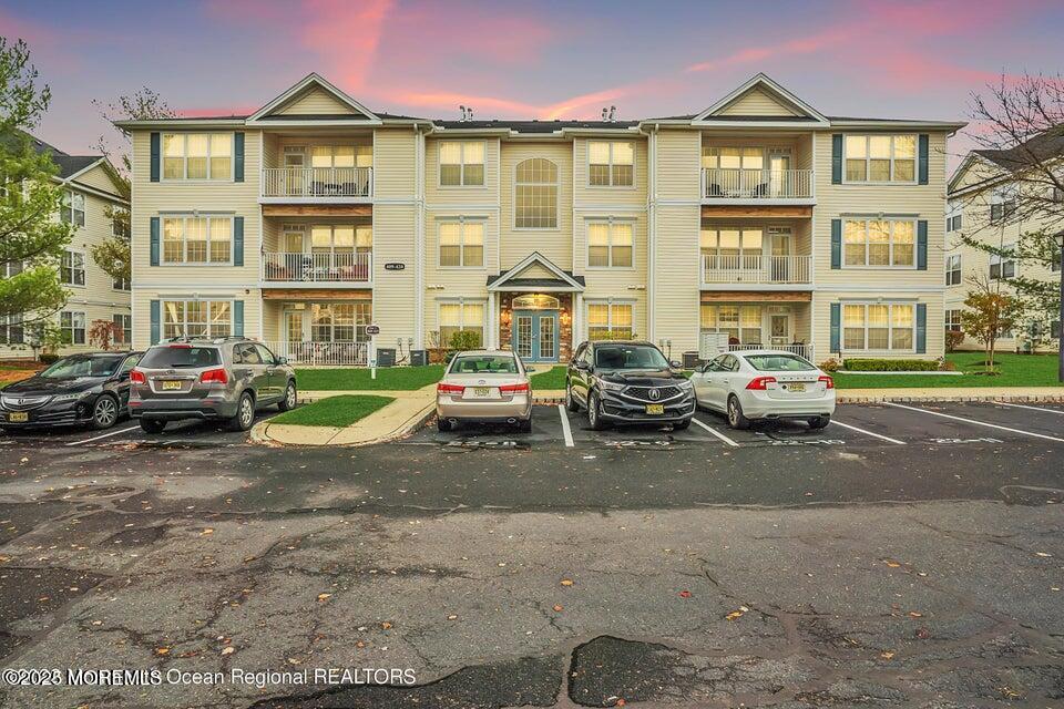 a view of a car parked in front of a brick building