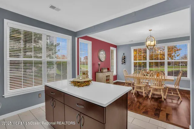 a view of a dining room with furniture window and outside view
