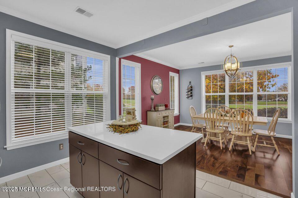 410 St Andrews Place Manalapan, NJ 07726 - Photo 12 of 23 a view of a dining room with furniture window and outside view