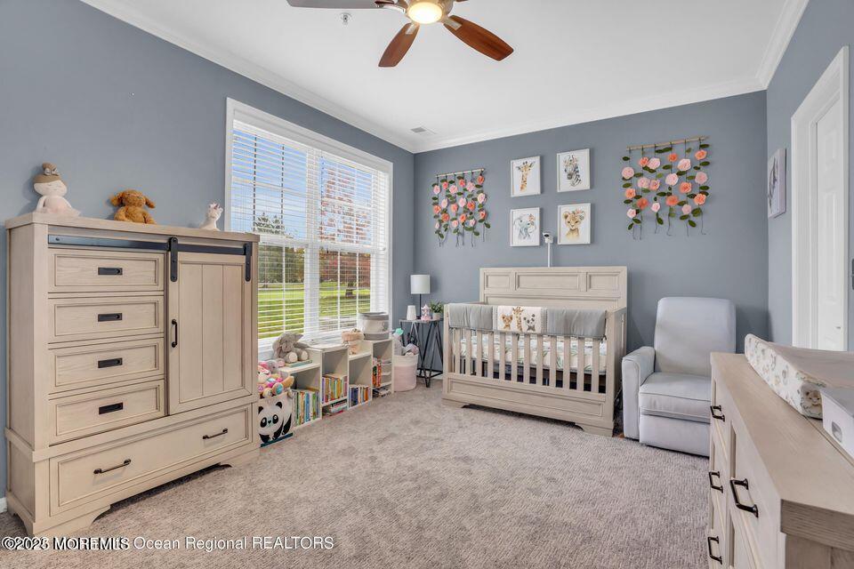 410 St Andrews Place Manalapan, NJ 07726 - Photo 14 of 23 a bedroom with furniture and a large window