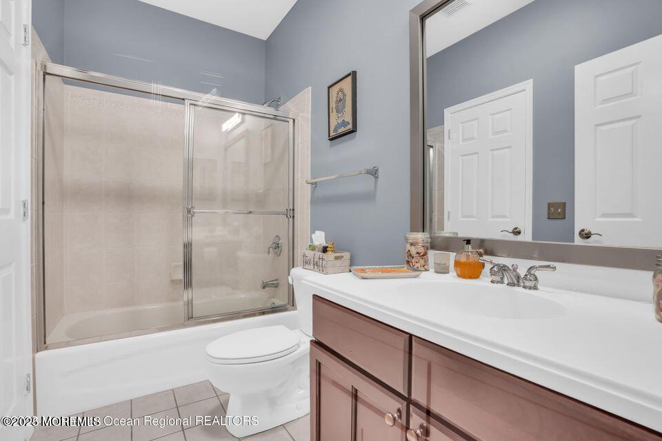 410 St Andrews Place Manalapan, NJ 07726 - Photo 15 of 23 a bathroom with a sink a toilet and shower
