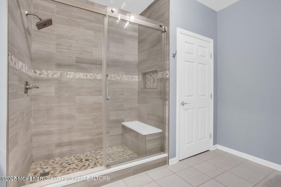 410 St Andrews Place Manalapan, NJ 07726 - Photo 18 of 23 a bathroom with a glass shower door