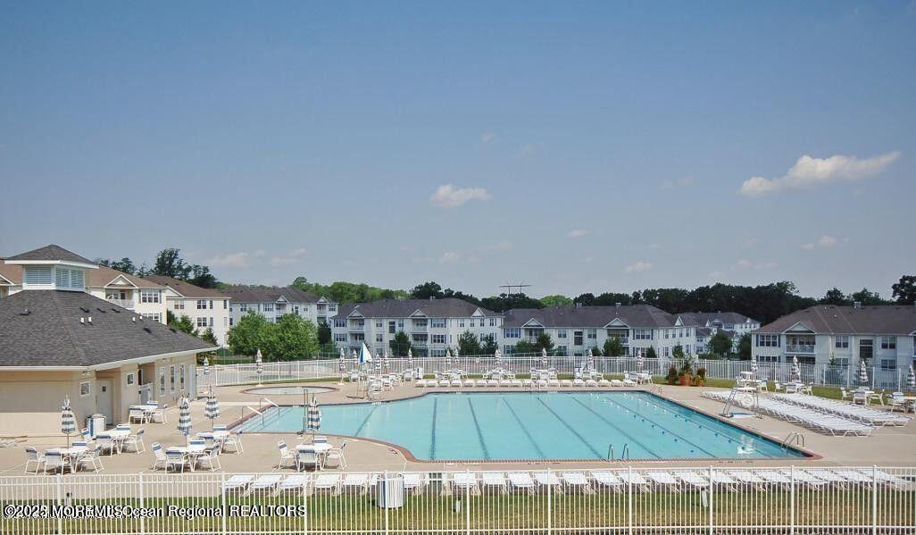 410 St Andrews Place Manalapan, NJ 07726 - Photo 23 of 23 a view of a swimming pool and a chairs