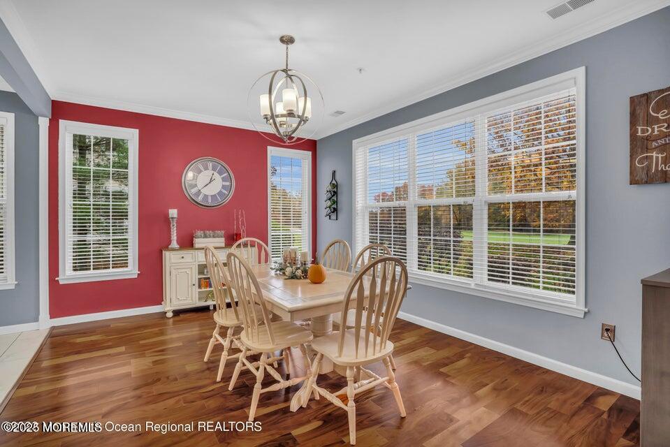 410 St Andrews Place Manalapan, NJ 07726 - Photo 7 of 23 a view of a dining room with furniture and chandelier