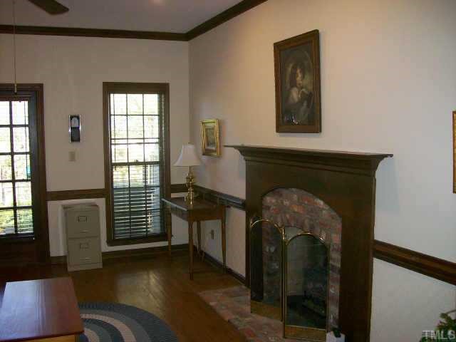 913 Albany Court Raleigh, NC 27615 - Photo 6 of 10 a living room with furniture and a fireplace