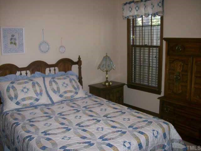 913 Albany Court Raleigh, NC 27615 - Photo 8 of 10 a bedroom with a bed and a window