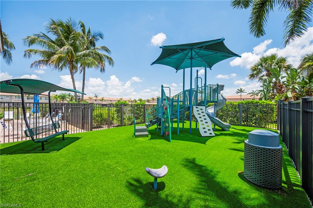 3916 Cherrybrook Loop Fort Myers, FL 33966 - Photo 30 of 31 Recreational area featuring a playground structure with slides and climbing elements, a covered swing, and artificial turf surfacing