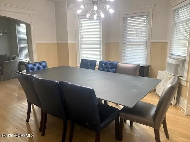 a view of a dining room with furniture and window
