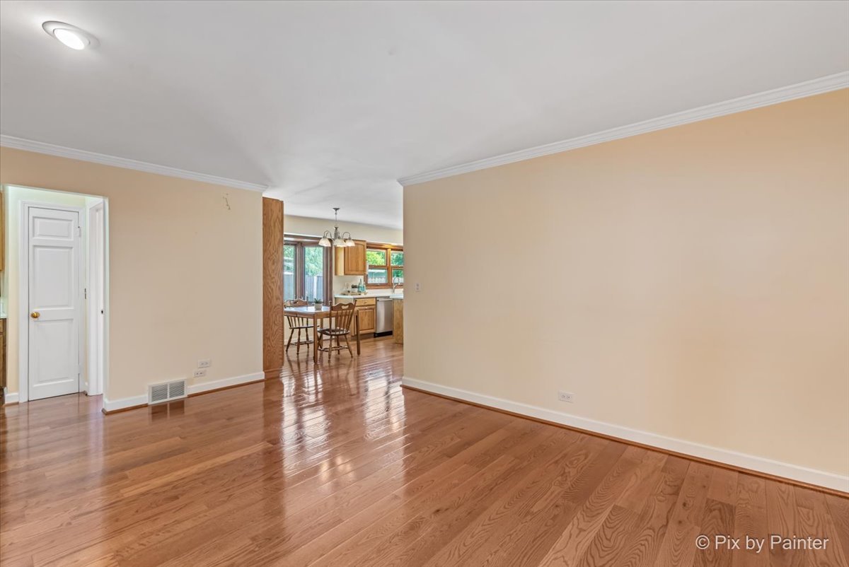 1599 Burning Trail Wheaton, IL 60189 - Photo 14 of 64 a view of empty room with wooden floor and fireplace