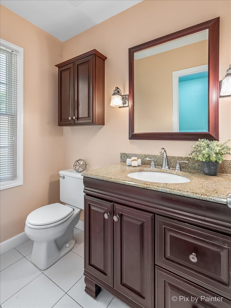 1599 Burning Trail Wheaton, IL 60189 - Photo 16 of 64 a bathroom with a granite countertop toilet sink and mirror