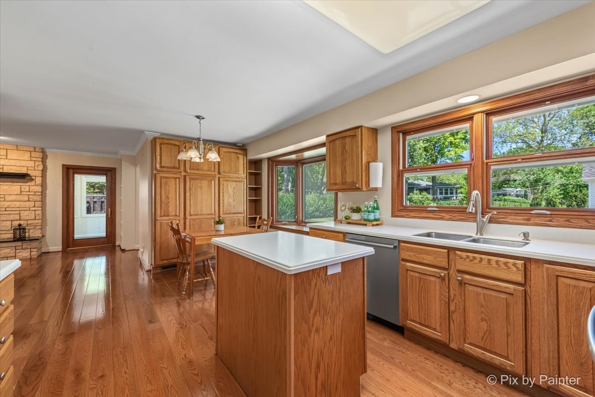 1599 Burning Trail Wheaton, IL 60189 - Photo 18 of 64 a dining hall with stainless steel appliances granite countertop a sink and wooden floor